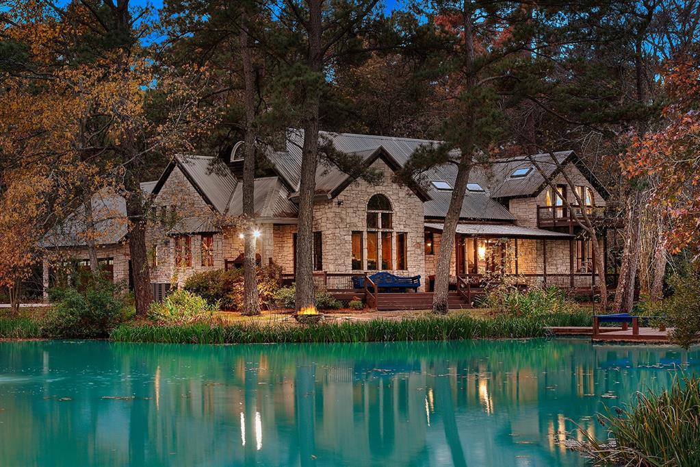 a front view of a house with a lake view