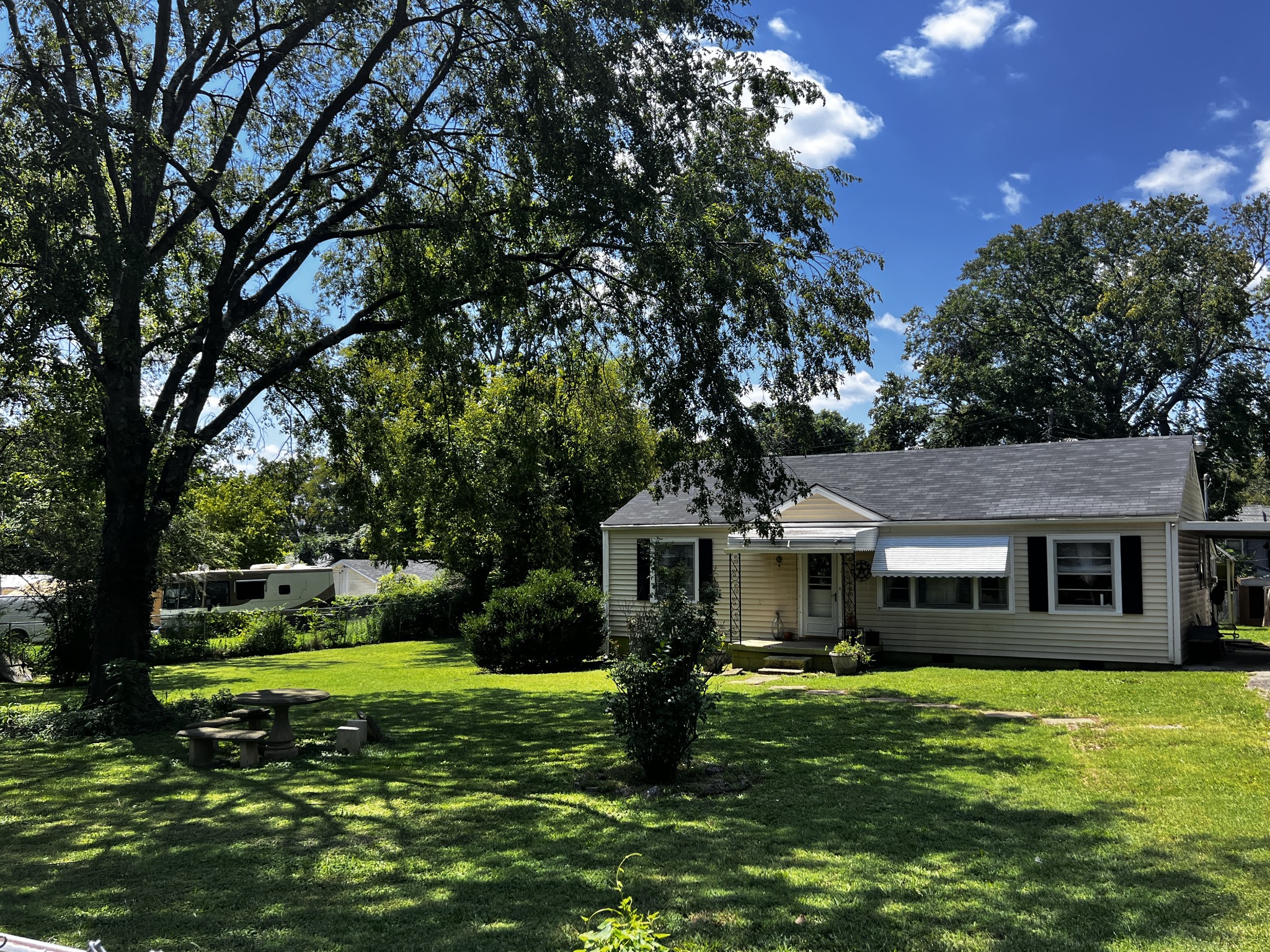 a front view of a house with a garden