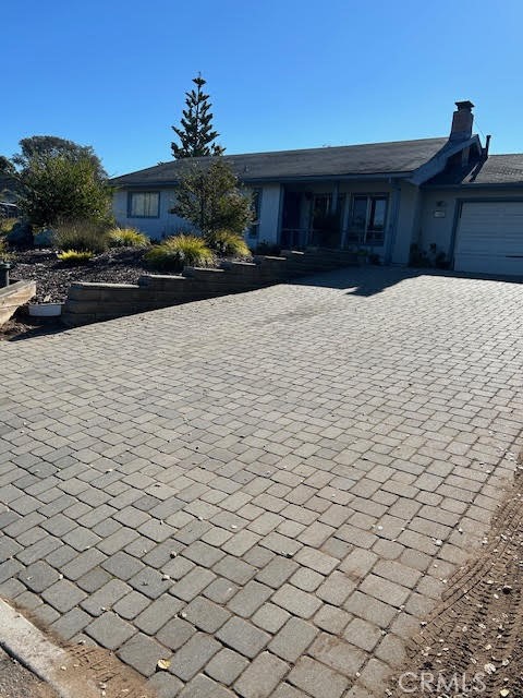 a view of house with a yard