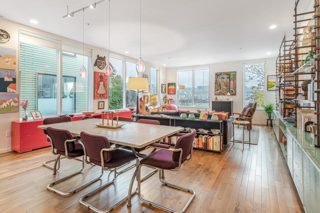 a view of a dining room with furniture window and wooden floor