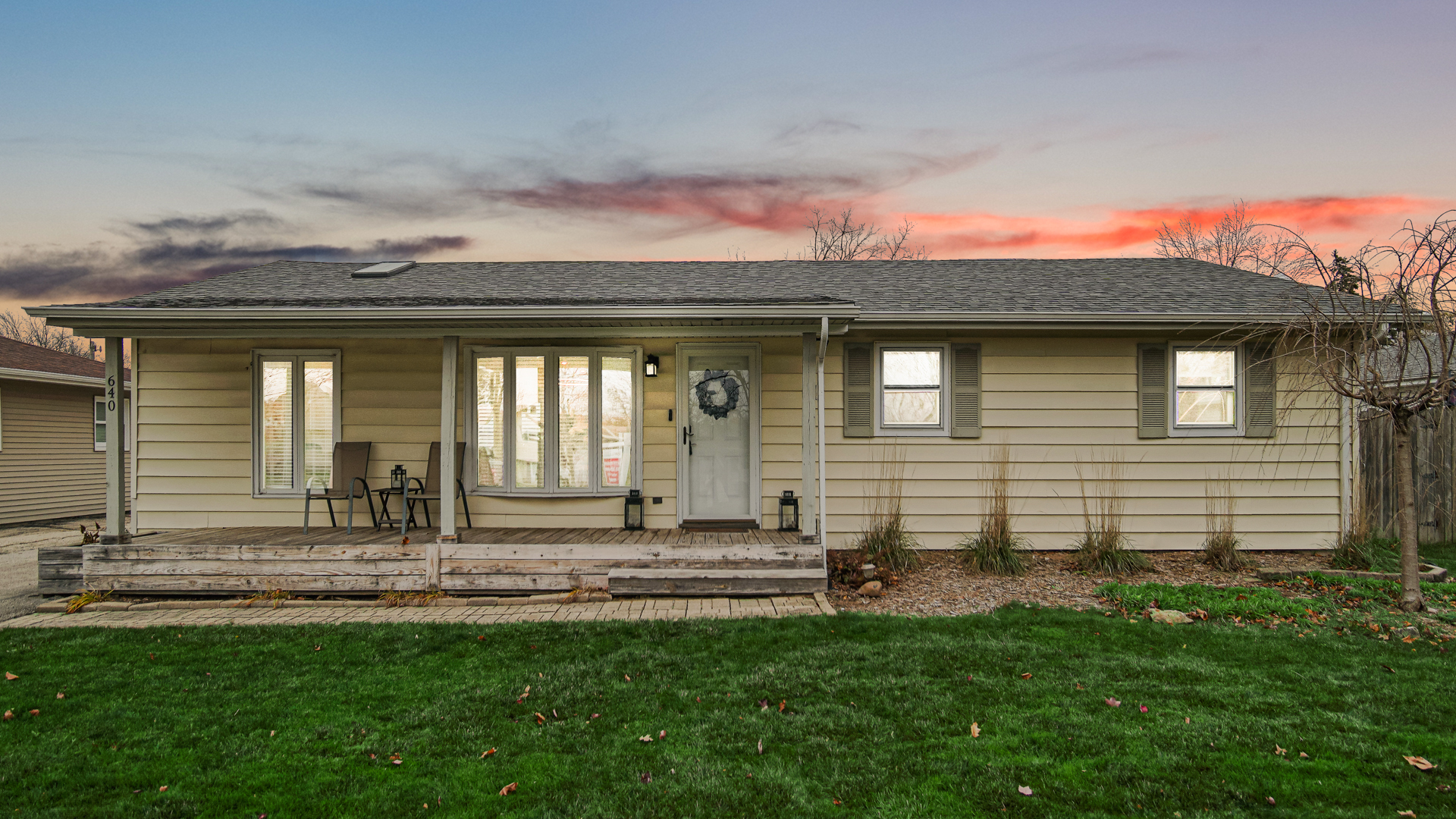 a front view of a house with a yard