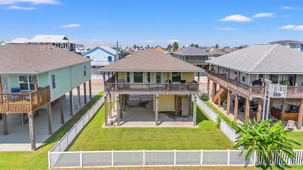 a view of a house with pool and chairs