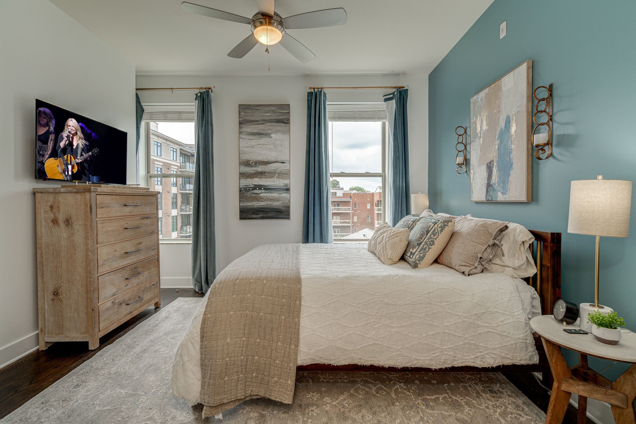 a bedroom with a bed and a flat screen tv