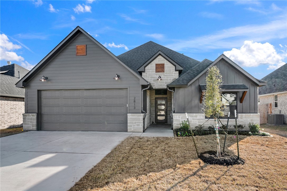 View of front of home with board and batten siding