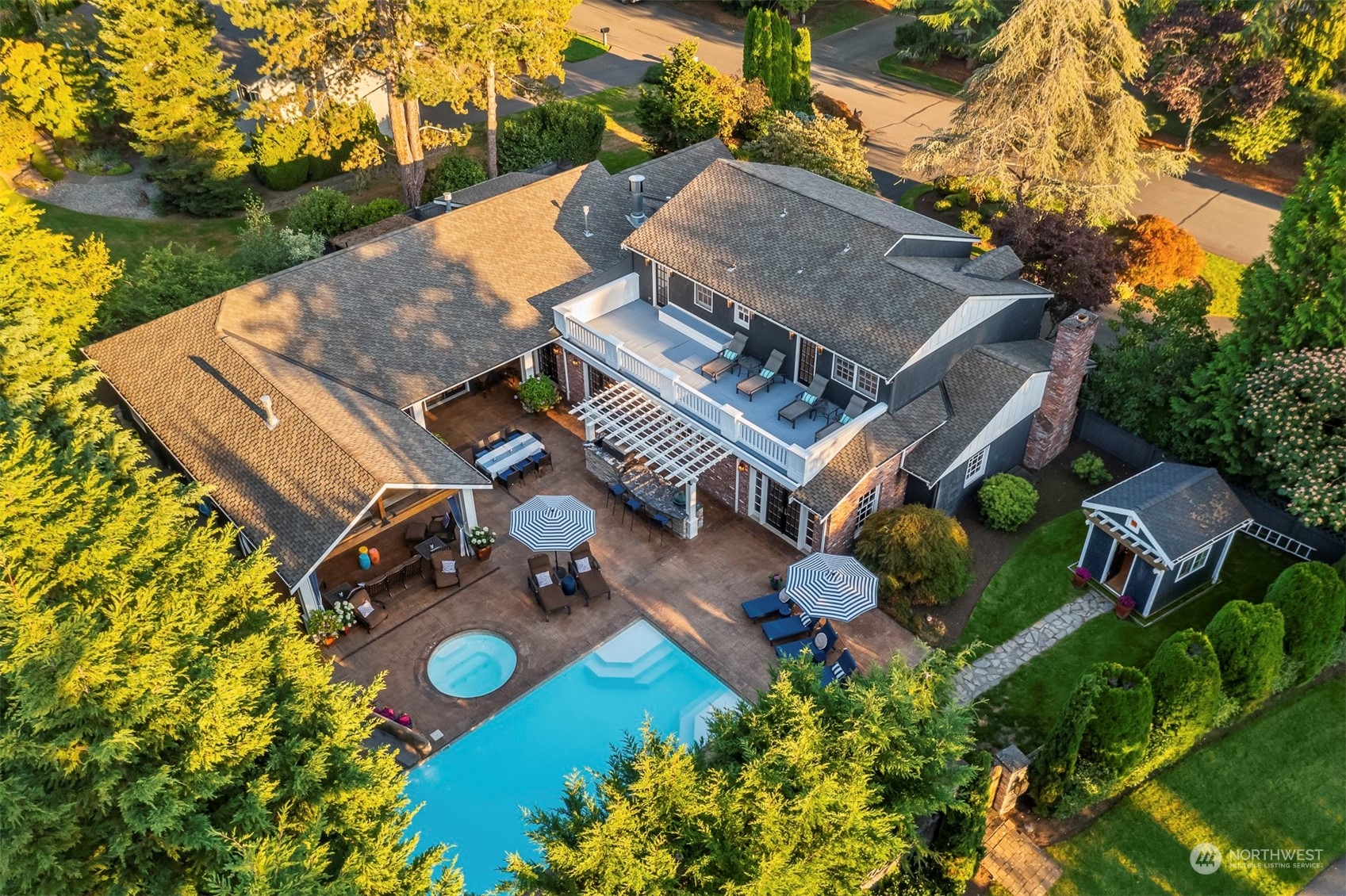 an aerial view of a house with garden space and street view