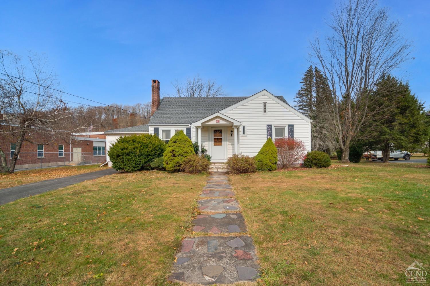 a front view of a house with a yard