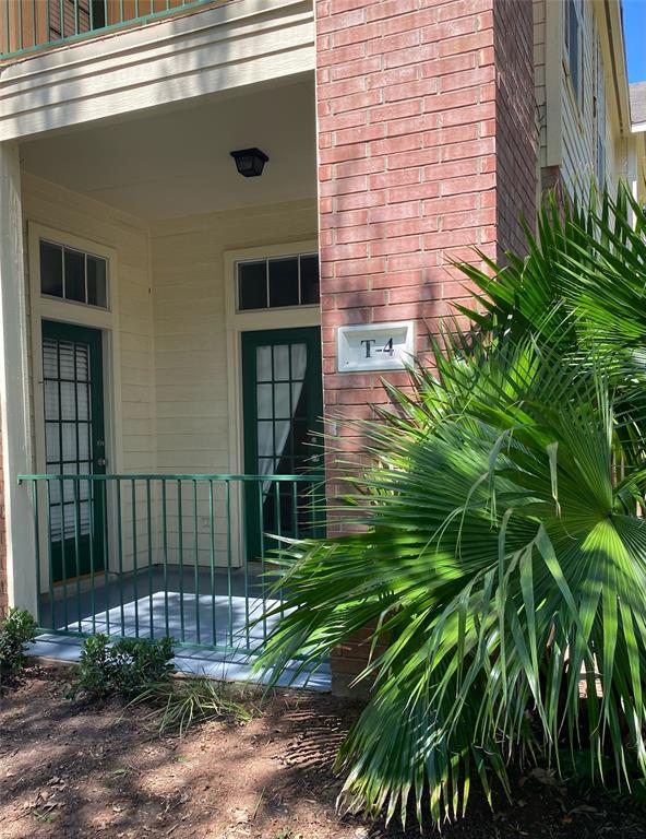 a view of a porch with a small yard