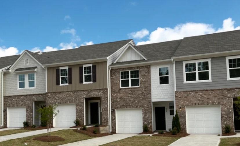 a front view of a house with a garage