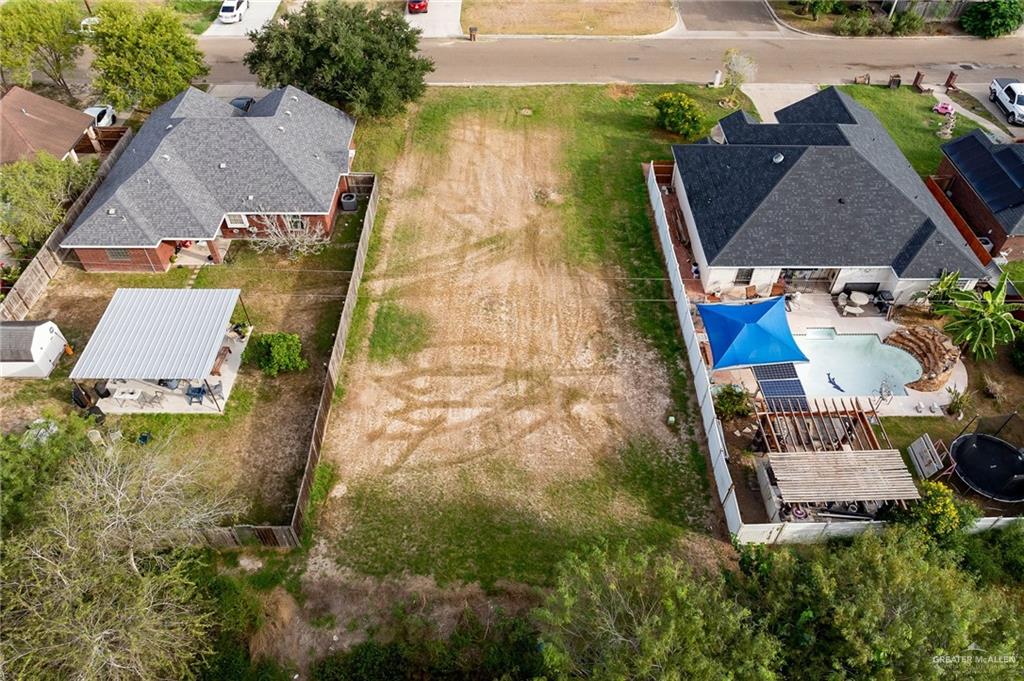 an aerial view of houses with outdoor space