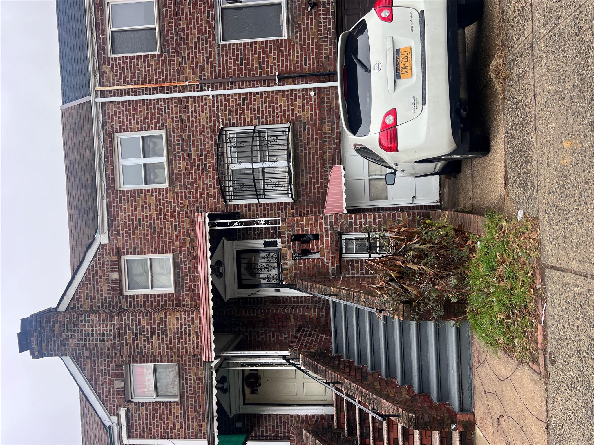 a car parked in front of a house