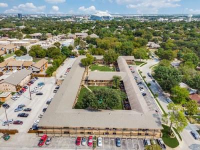 an aerial view of residential houses with outdoor space