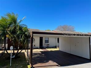 a view of a house with a backyard