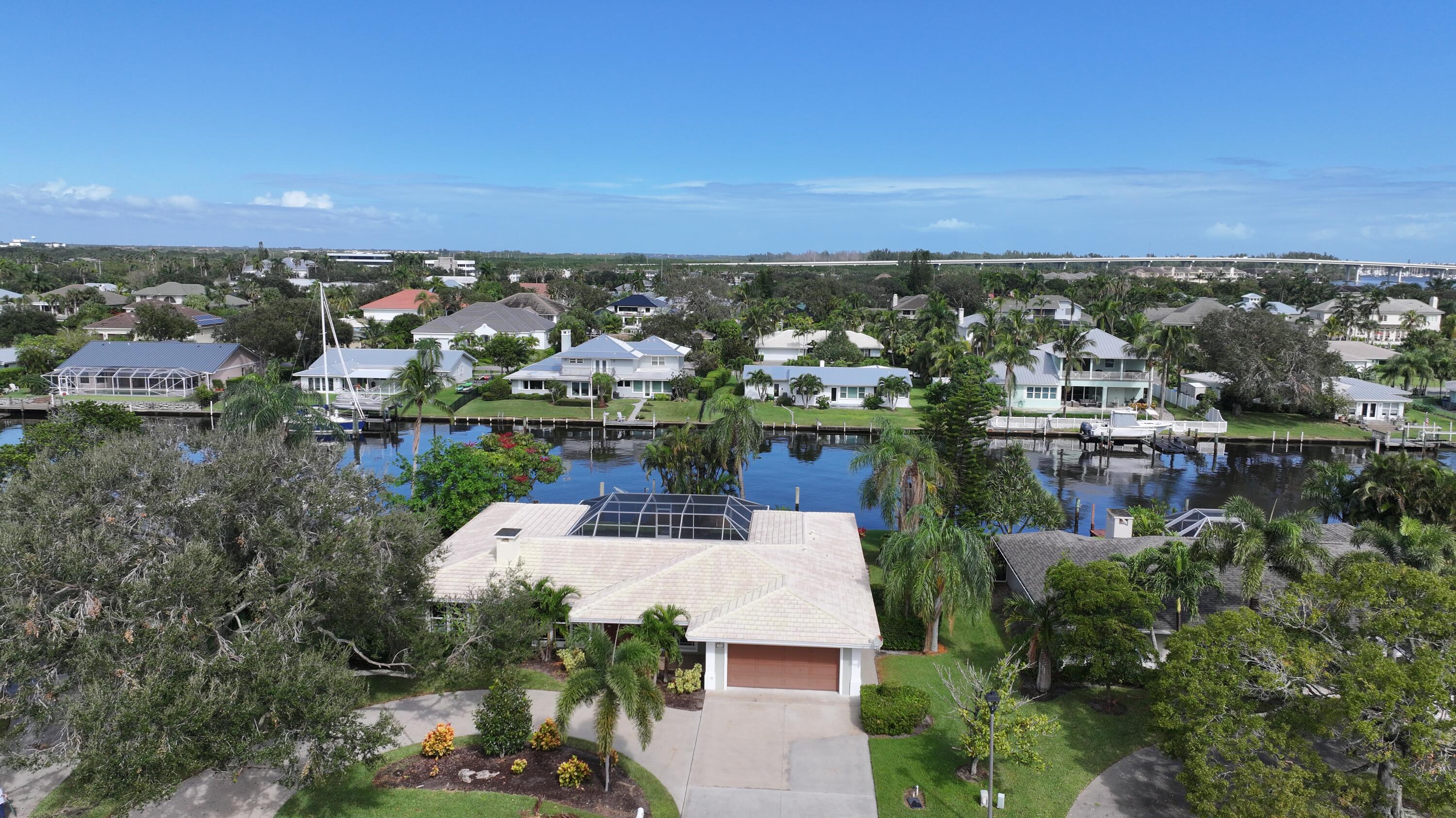 an aerial view of a house with a lake view