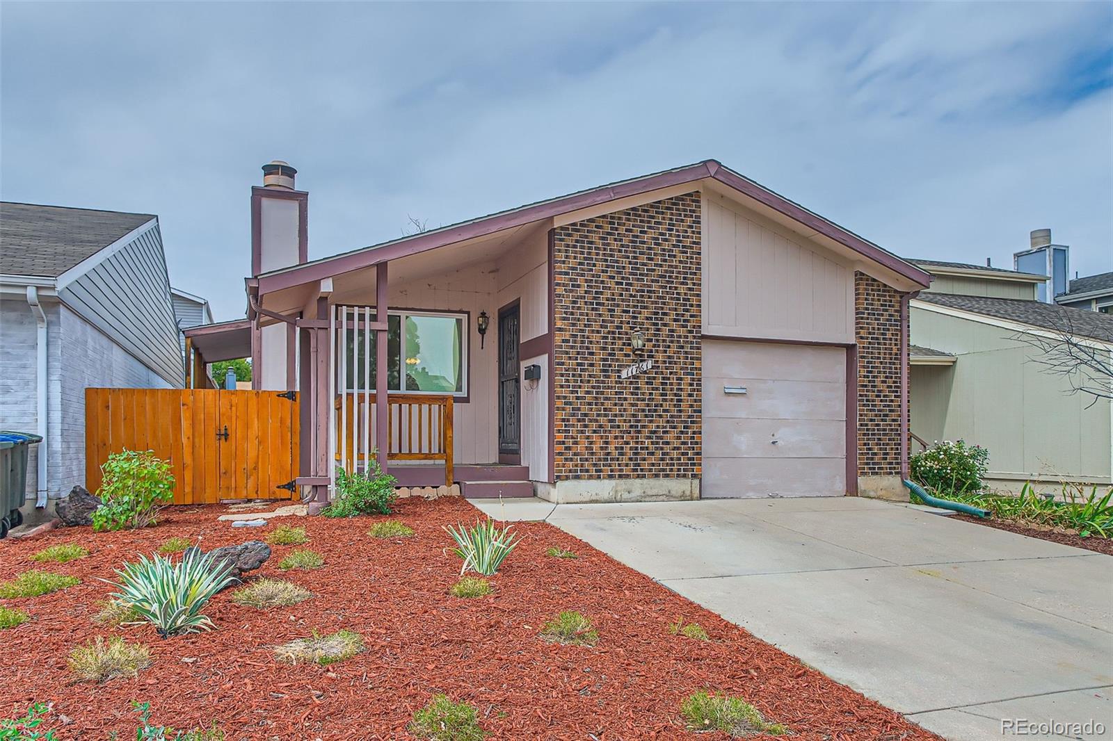 a front view of a house with a garage