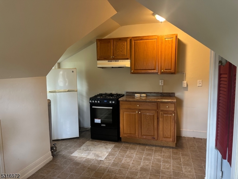 a kitchen with stainless steel appliances a refrigerator and a sink