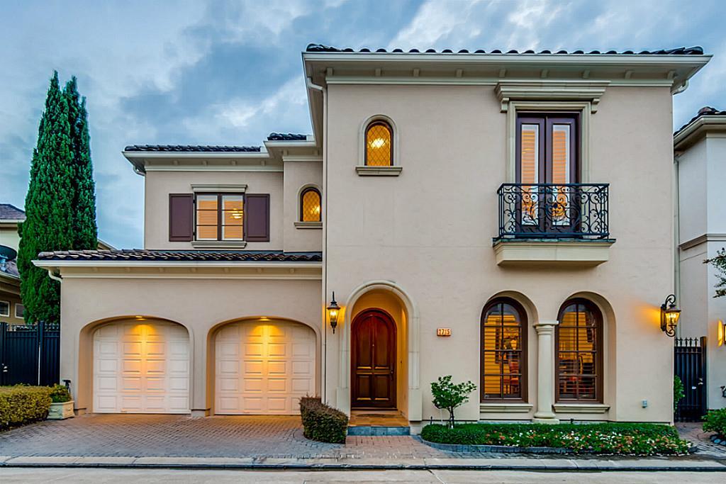 A stunning two-story patio home, custom-built by HWD, showcasing a beautiful lifetime tile roof and elegant architectural details. Located in the prestigious Royal Oaks Country Club, this home offers a striking curb appeal and a welcoming front entrance.