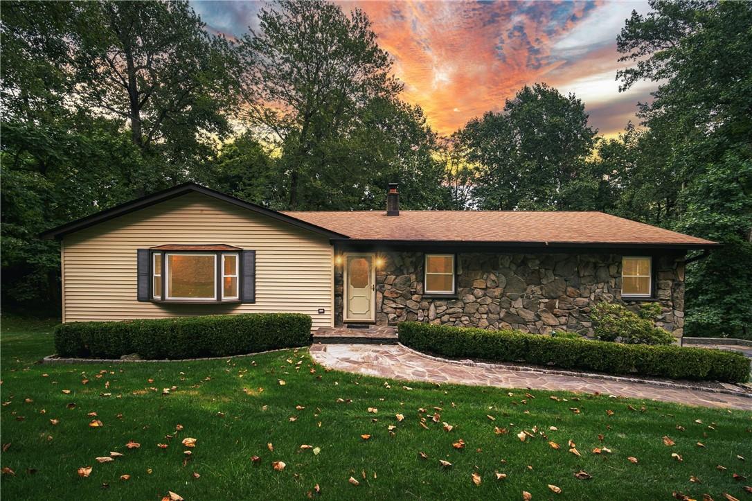 Ranch-style house with a yard