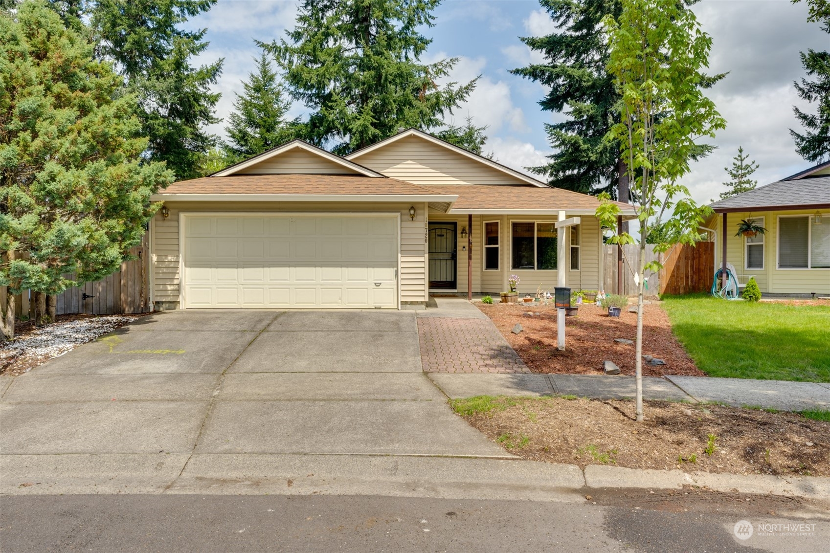 a front view of a house with yard