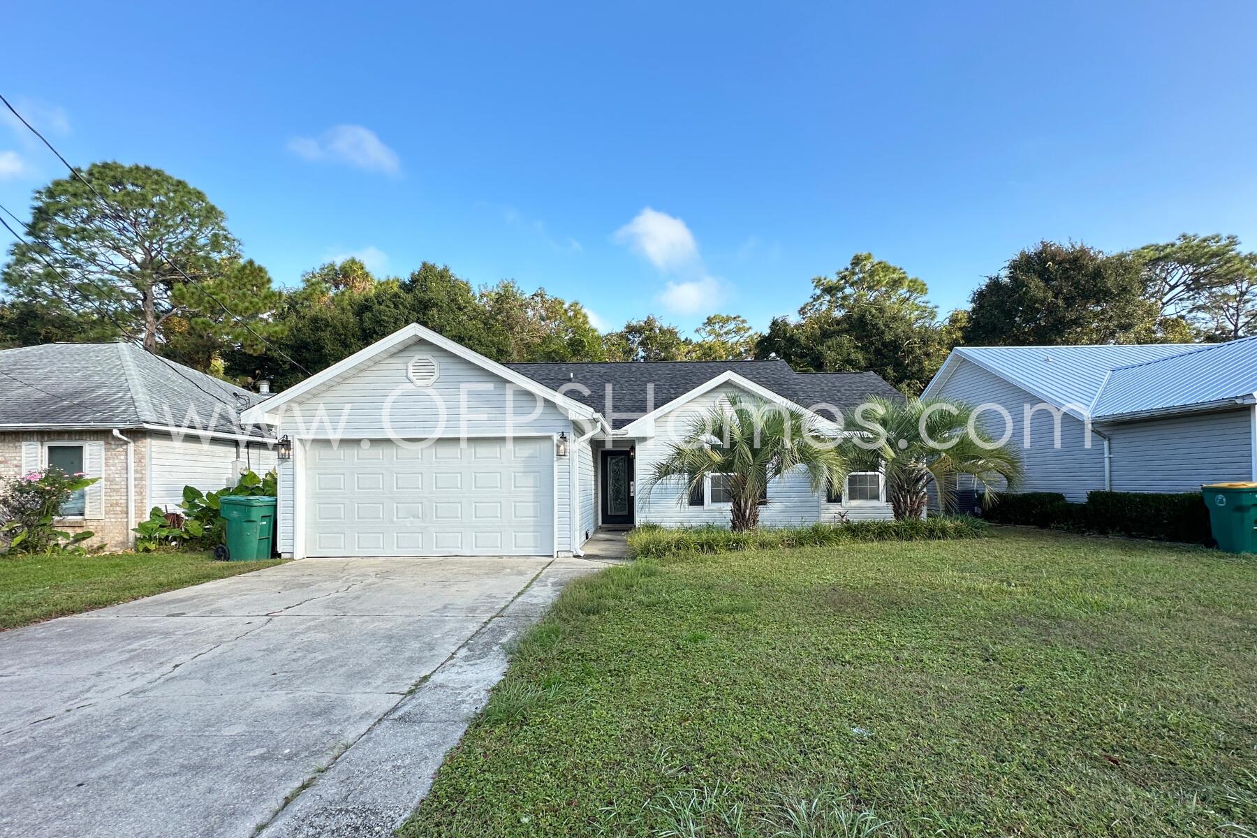 front view of a house with a yard