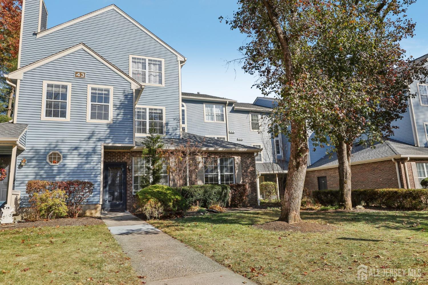 front view of a house with a yard