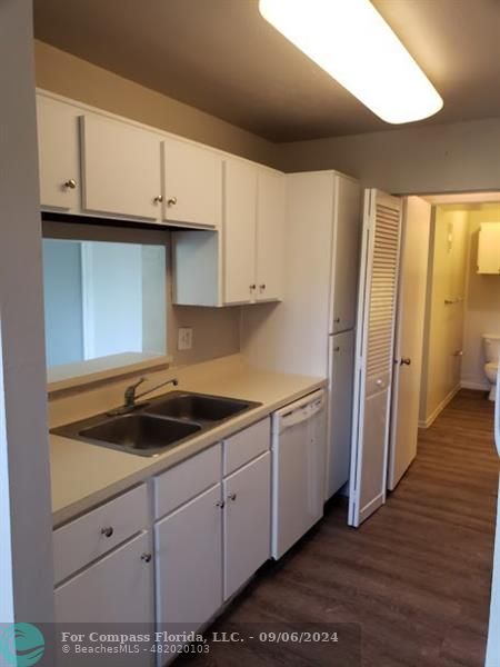 a kitchen with a sink and cabinets