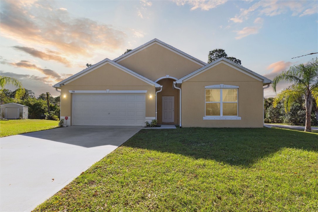 a front view of a house with a yard