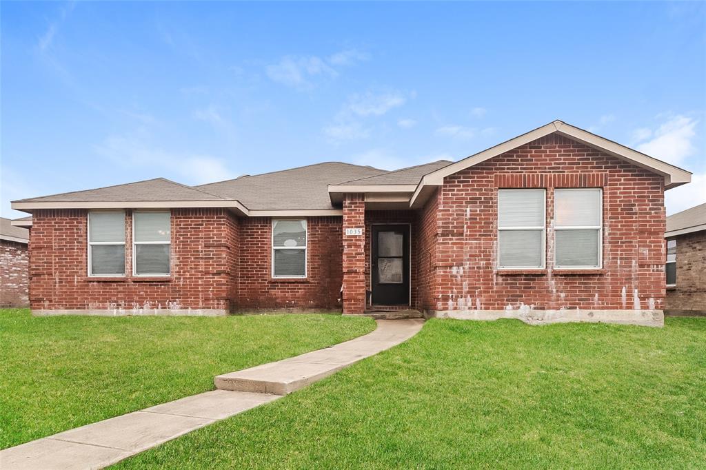 front view of a house with a yard