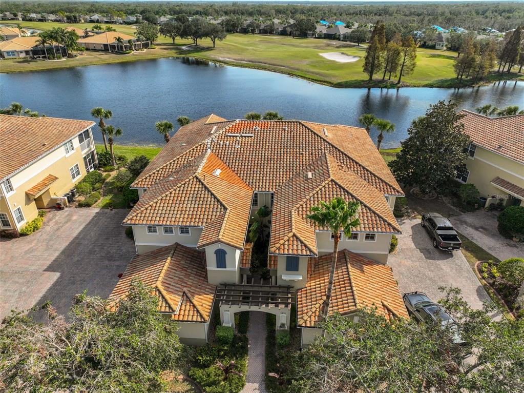 an aerial view of a house with a lake view