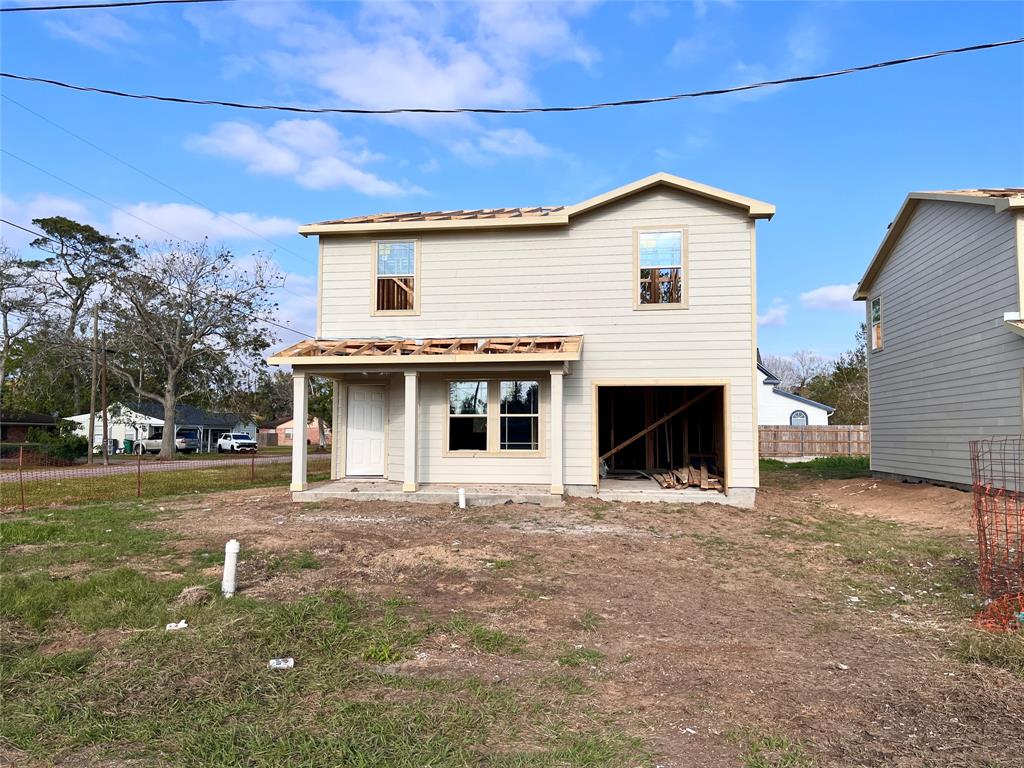 a view of a house with a yard and garage