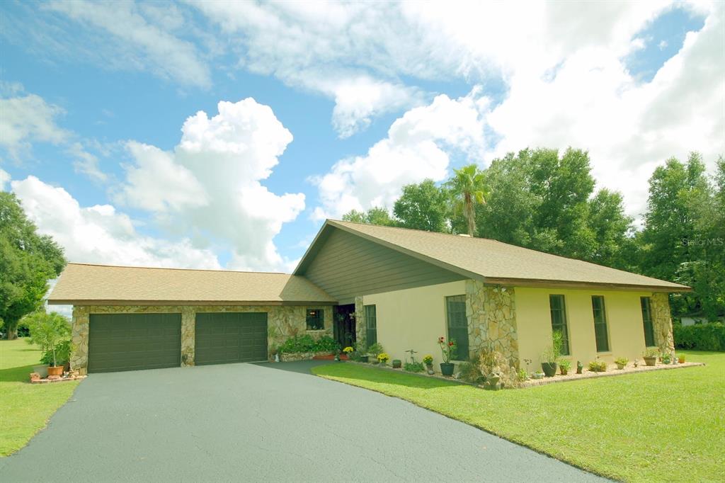 a view of house with yard