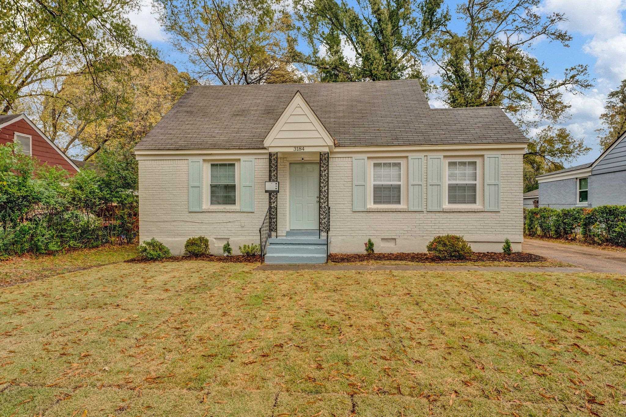 View of front of property with a front yard