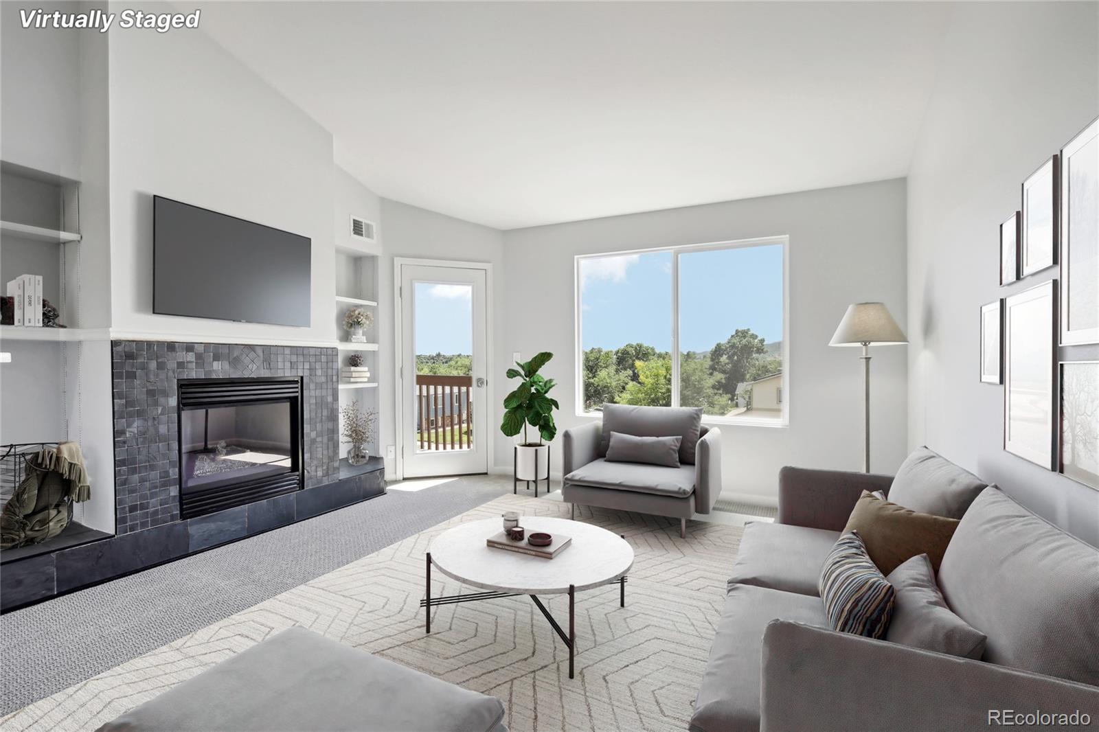 a living room with furniture and a fireplace