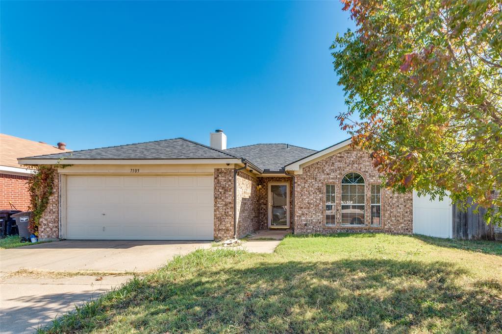 front view of a house with a big yard