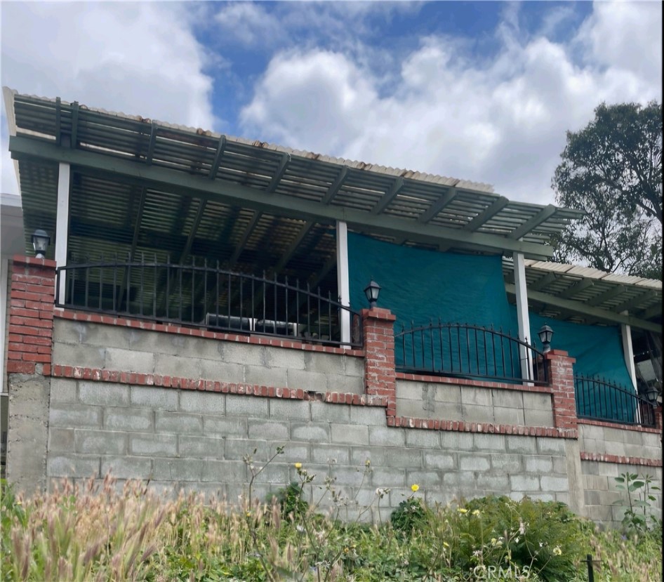 a view of a brick house with a large window