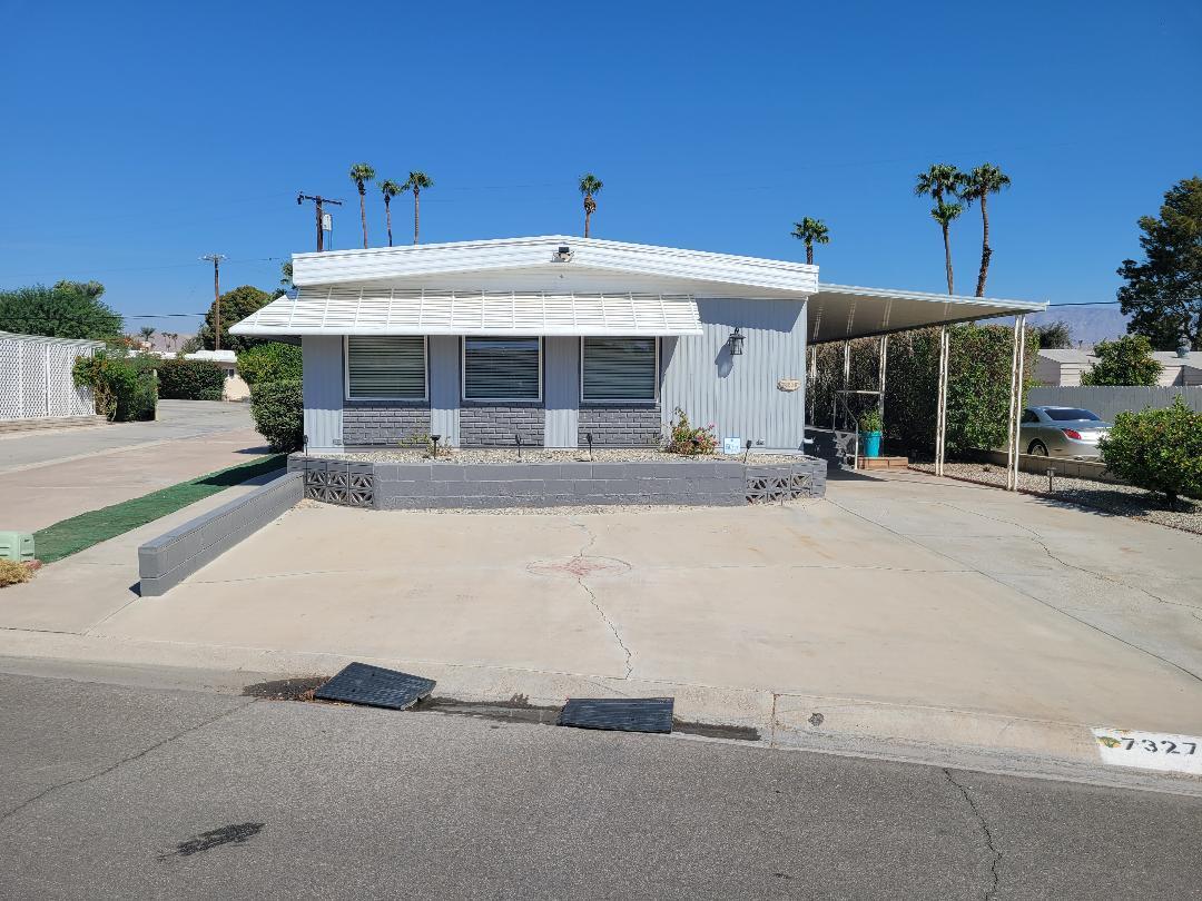 front view of a building with a yard