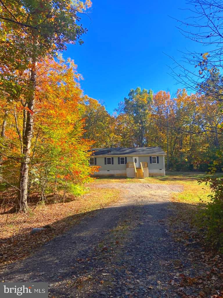 a view of house with outdoor space