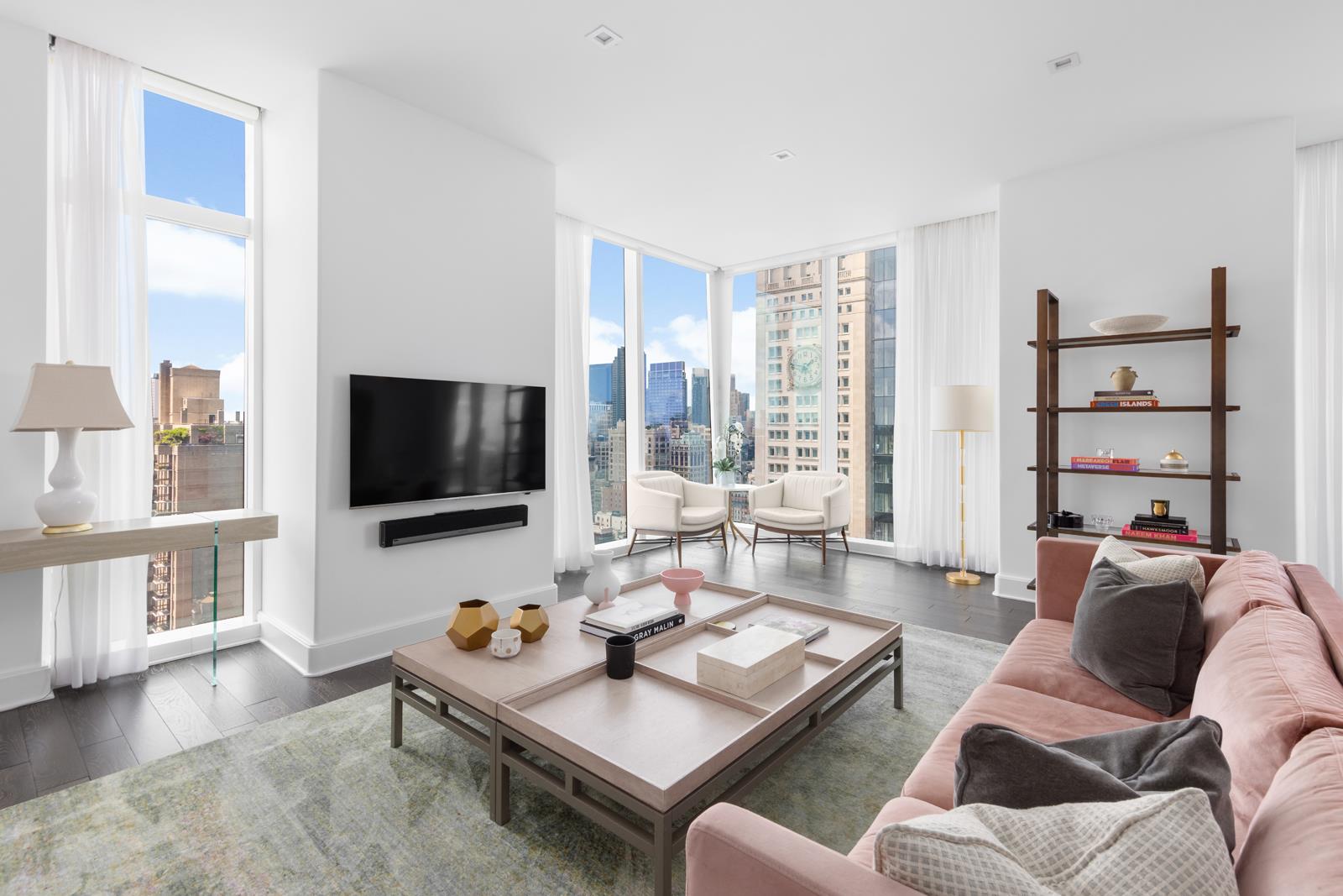 a living room with furniture and a flat screen tv