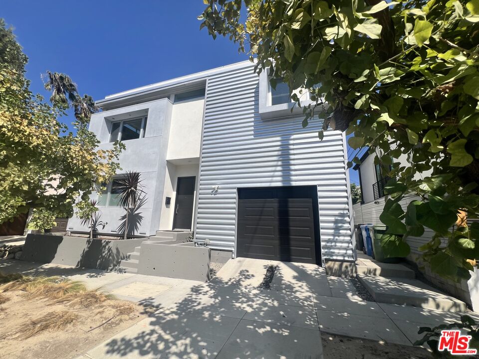 a view of a house with a tree