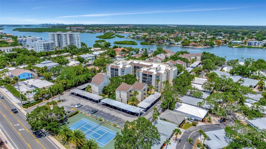 an aerial view of residential building and lake