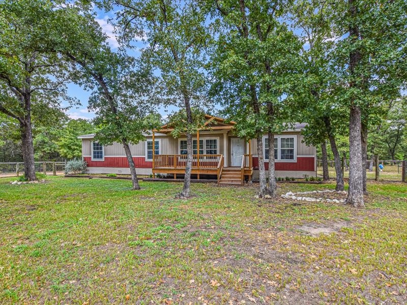 front view of a house with a big yard