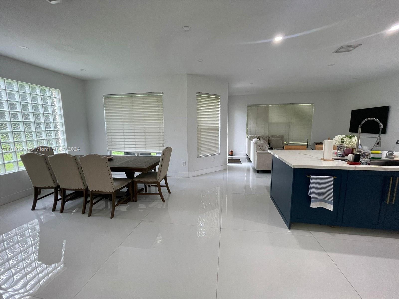 a view of a dining room with furniture and window