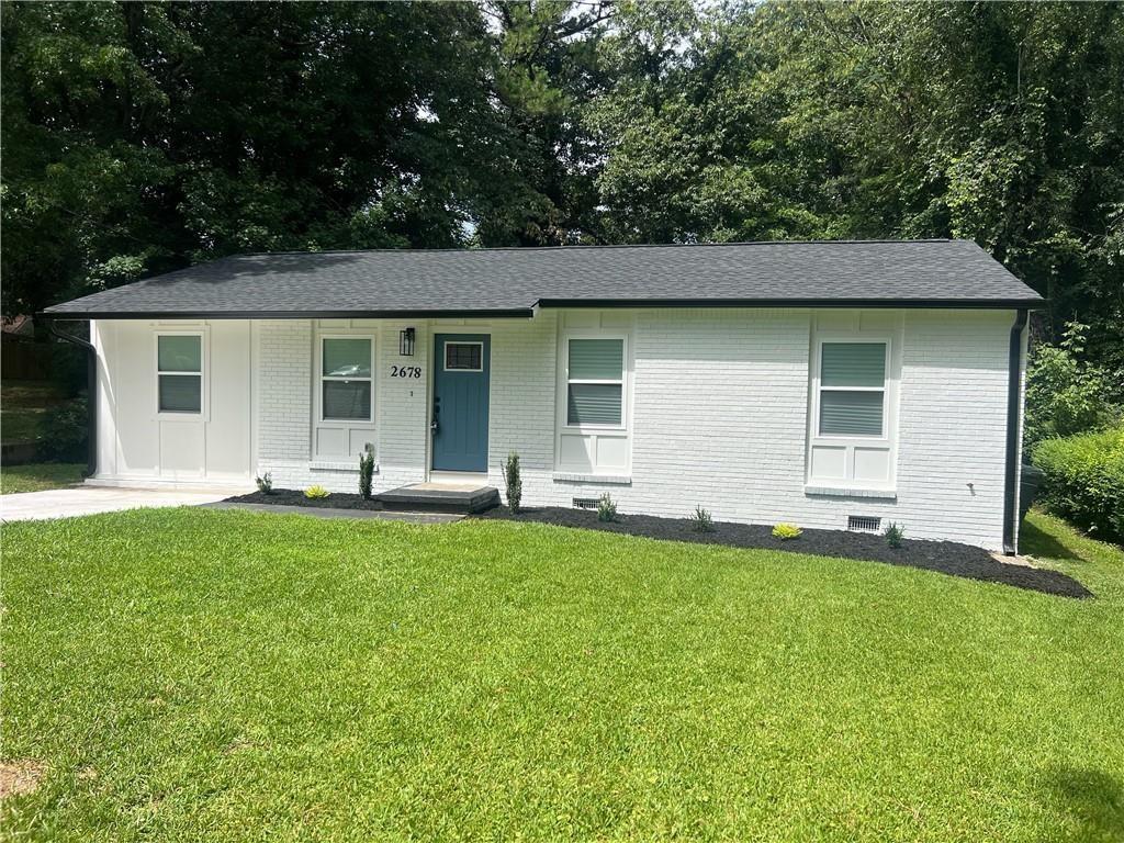 front view of a house with a yard