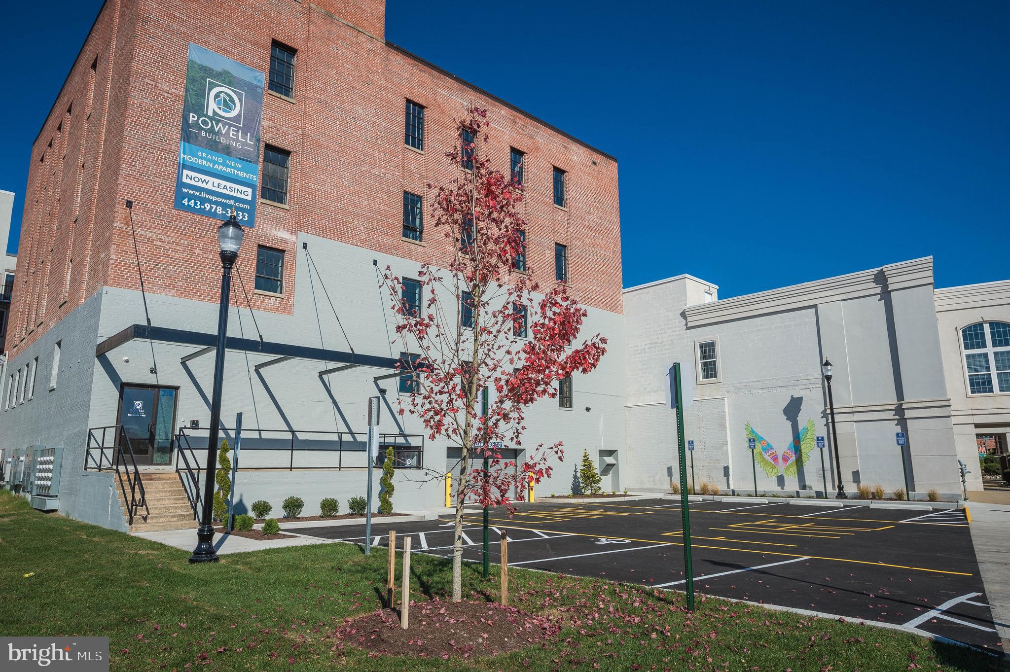 a view of a building with a yard