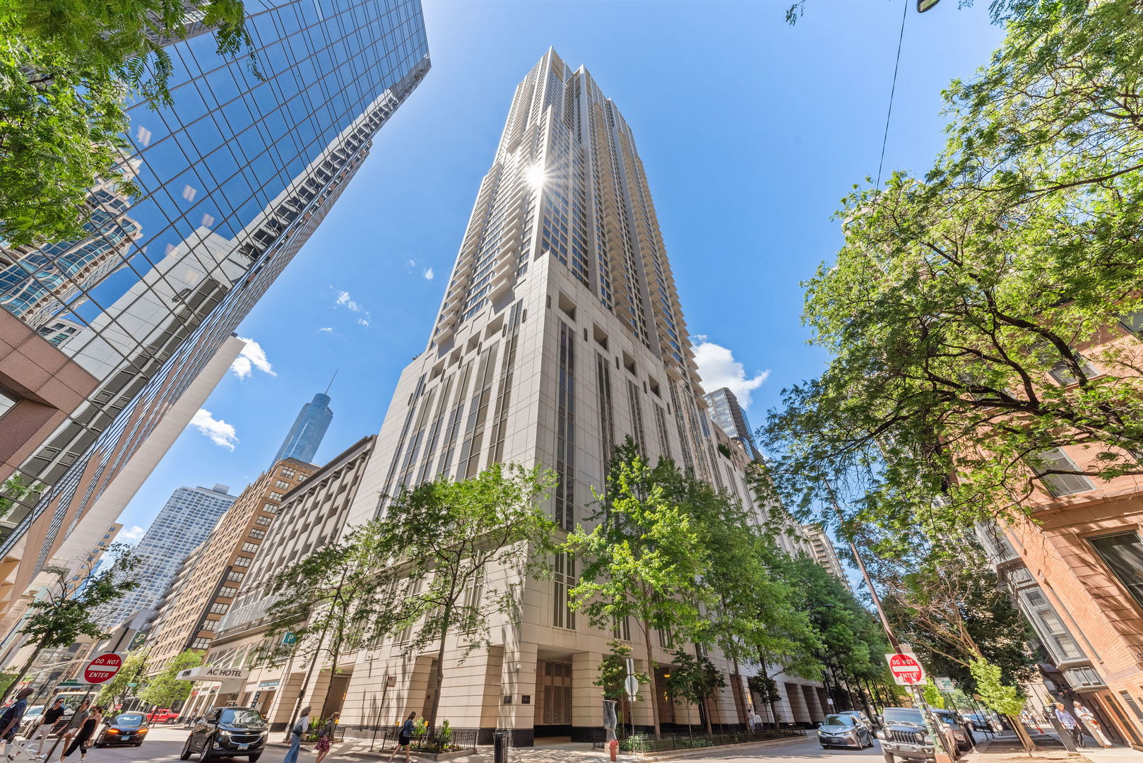 a view of a tall building next to a road