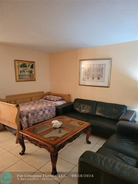 a living room with furniture and a rug