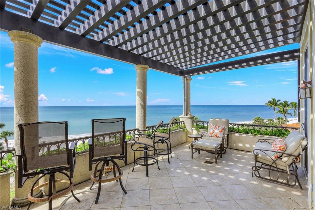 a patio with table and chairs