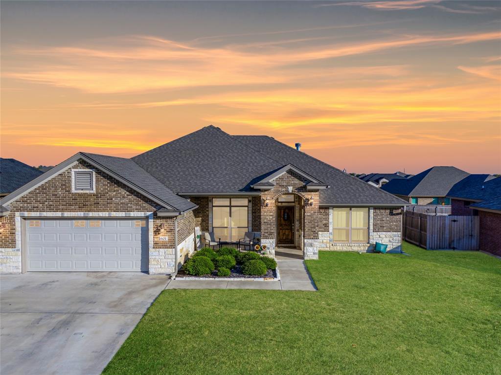 front view of a house with a yard