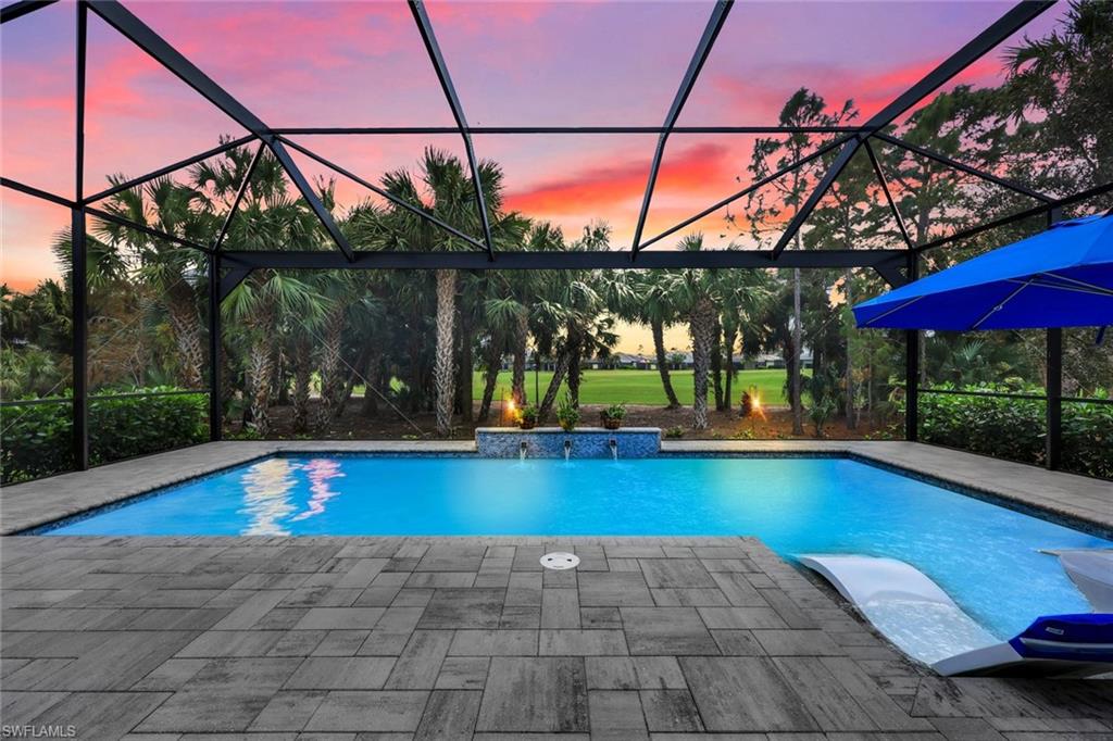 a view of swimming pool with a yard