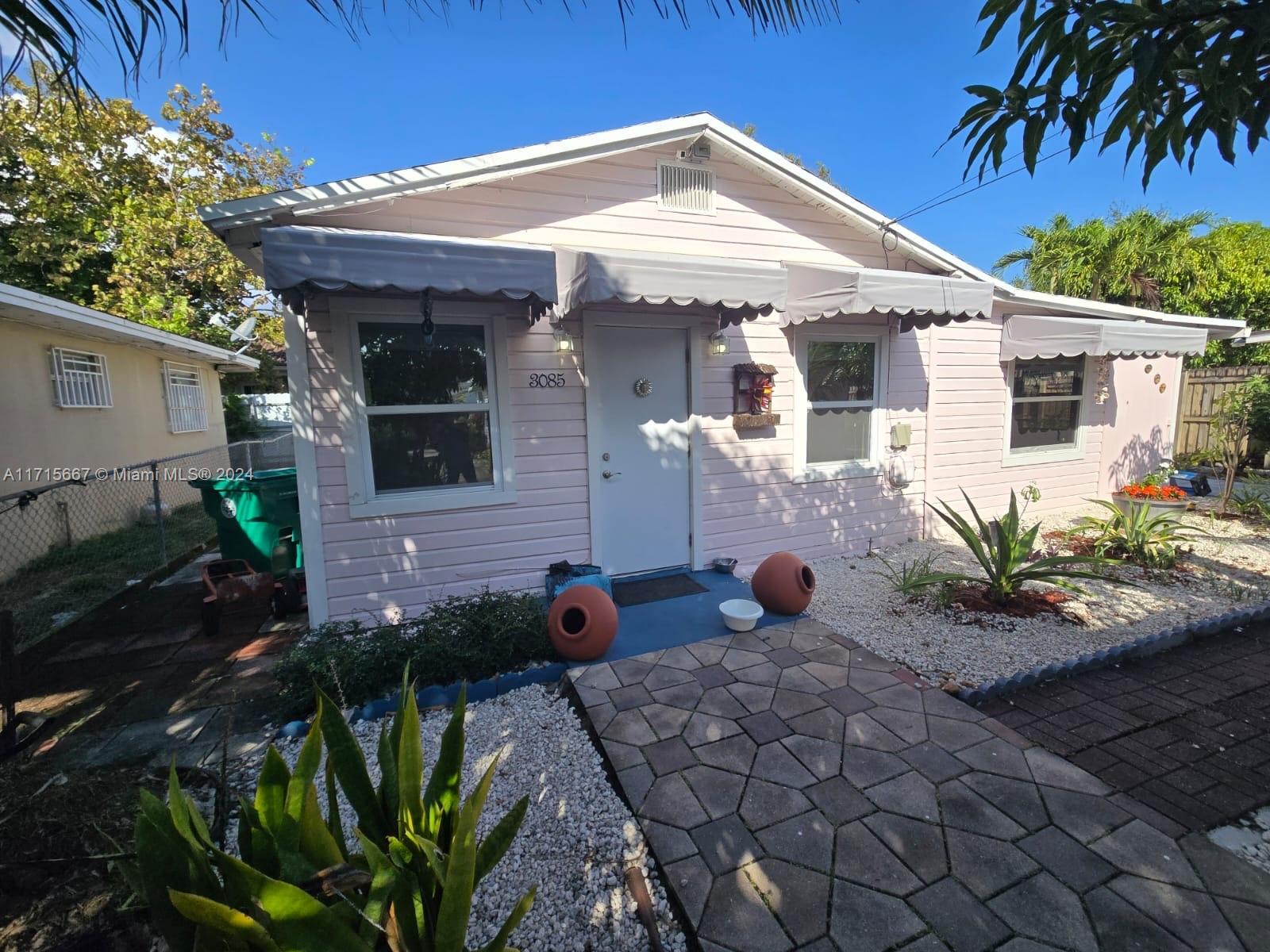 a front view of a house with patio