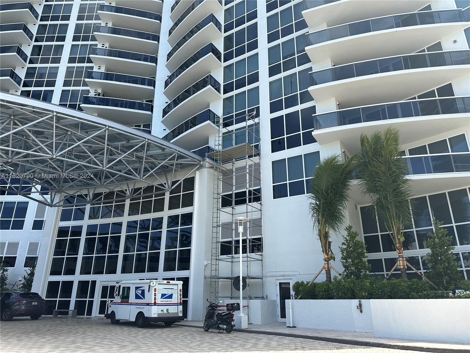 a view of parking area and building